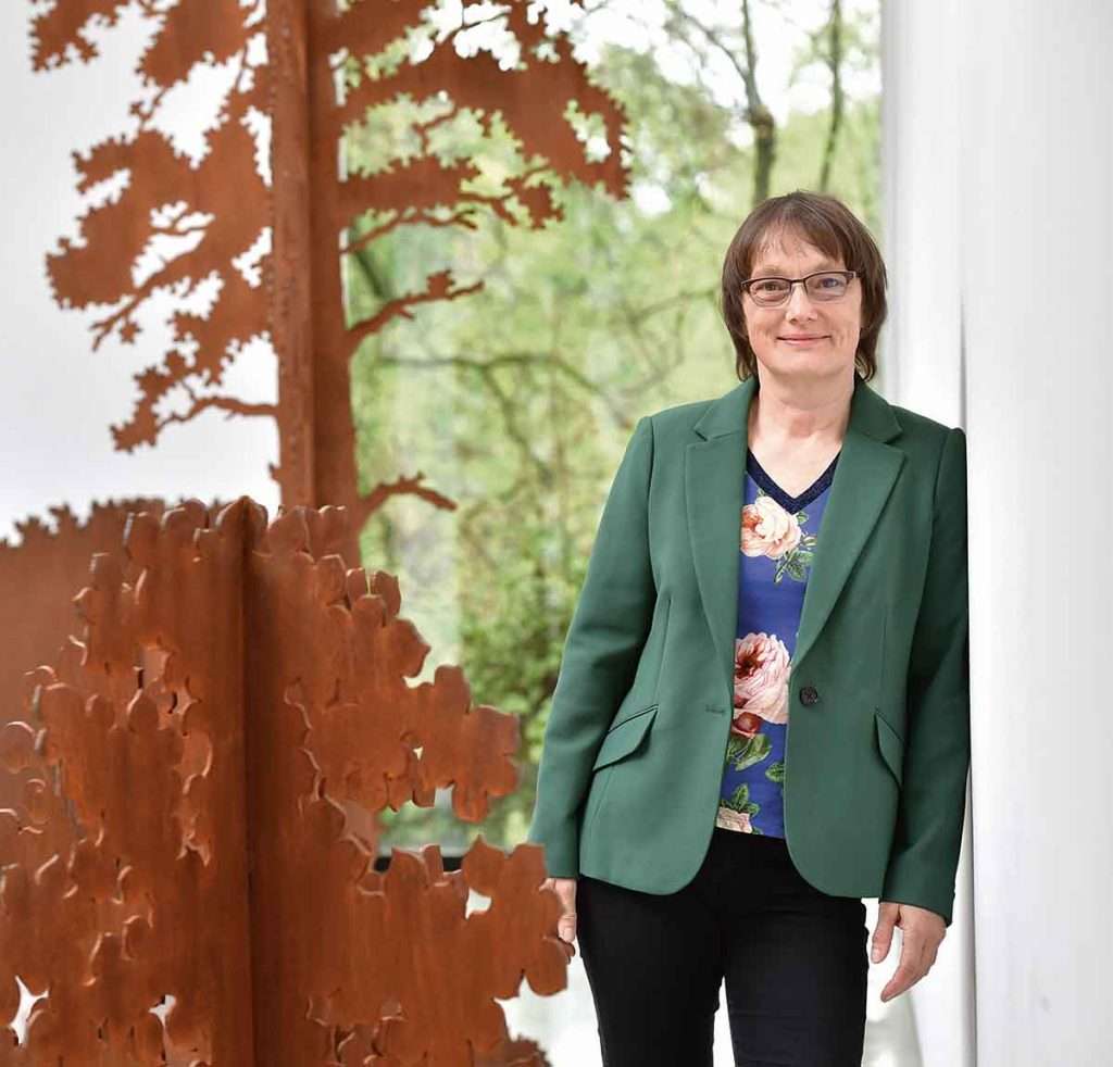 Andrea Geile with her Corten steel garden art