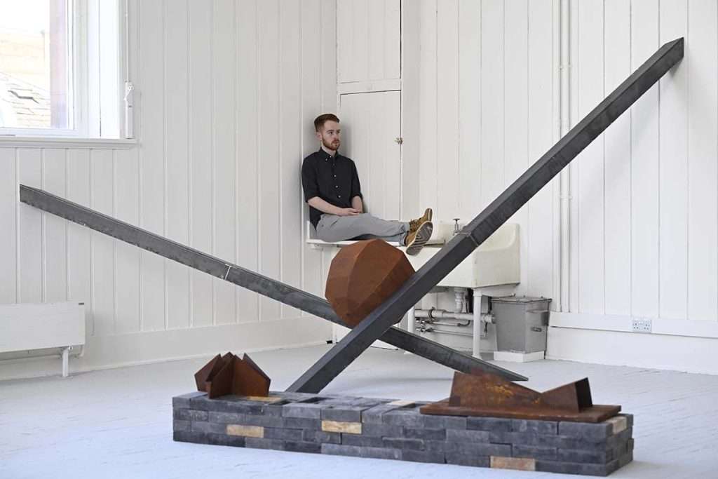 Christian Sloan with his work. image Neil Hanna