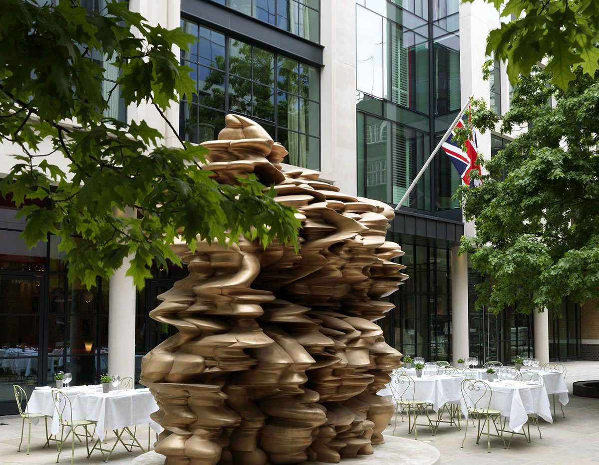 Tony Cragg’s Group (2014) stands outside the Ham Yard Hotel