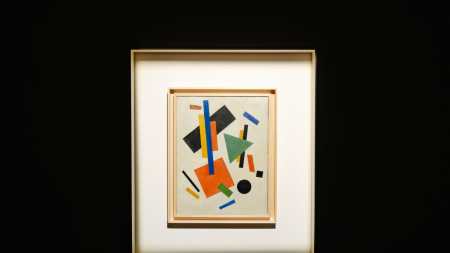 A painting comprising various shapes including squares, circles, and rectangles.